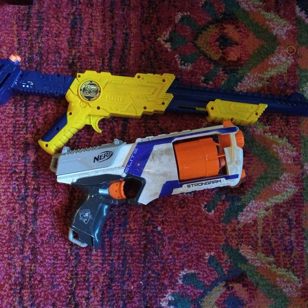 2 foam shooter guns (one NERF)